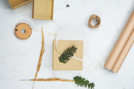 holiday gift wrapping with wrapping paper and twine