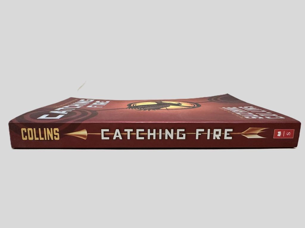 Catching Fire by Suzanne Collins - Fehmerling Books